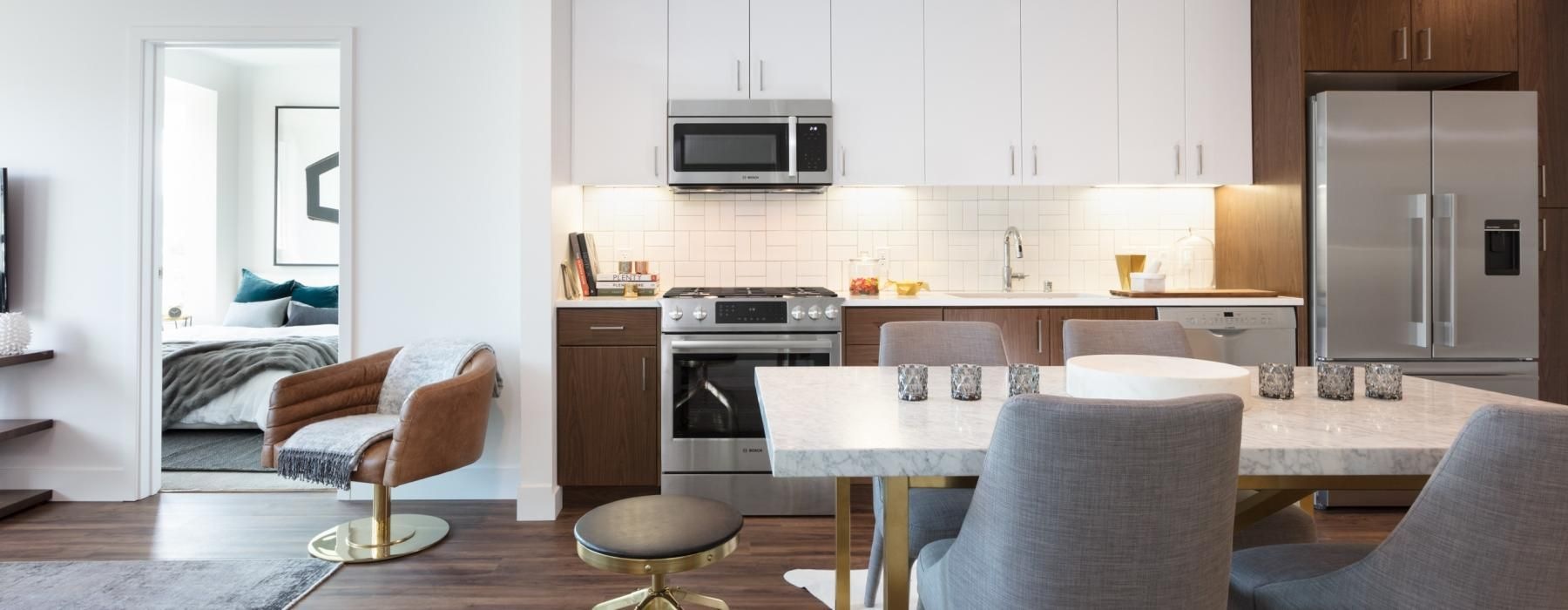 a kitchen with a table and chairs