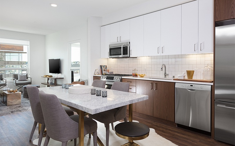 a kitchen with a table and chairs