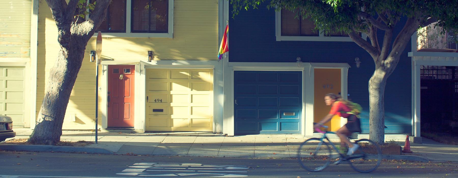 a person riding a bicycle on a street